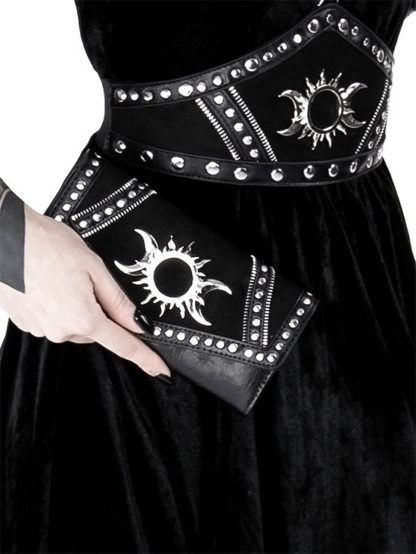 A woman holding the purse showing how it fits nicely in the hand