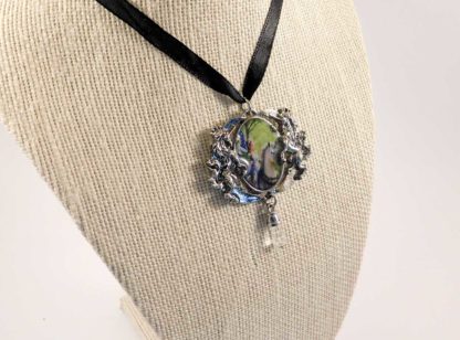 A side view showing the black silk ribbon necklace