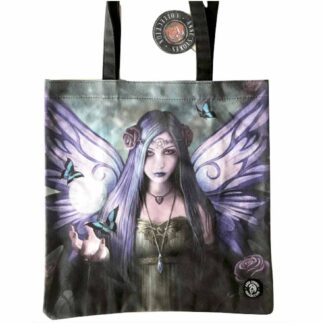 This canvas tote bag is printed with an image of a purple winged fairy with purple and blue hair held back with purple rose clips. She's wearing a green dress - her hand is outstretched with blue winged butterflies fluttering above it.