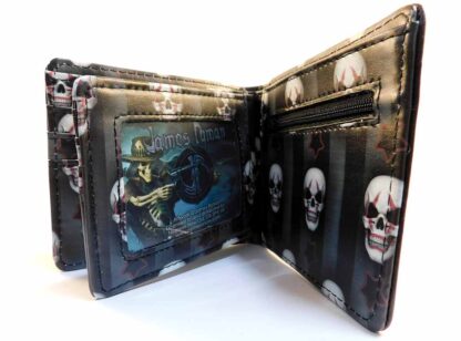 On the right hand side of the flap there is a clear plastic sleeve and a zippered coin section. The repeating white skull with red clown makeup continues