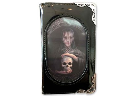 The front of this purse has an image of a solemn looking girl hodling a skull in her hands, she's veiled and has the words carpe diem inscribed above her