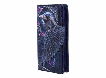 The wing of the raven stretches around the purse and forms the closure - its super cool