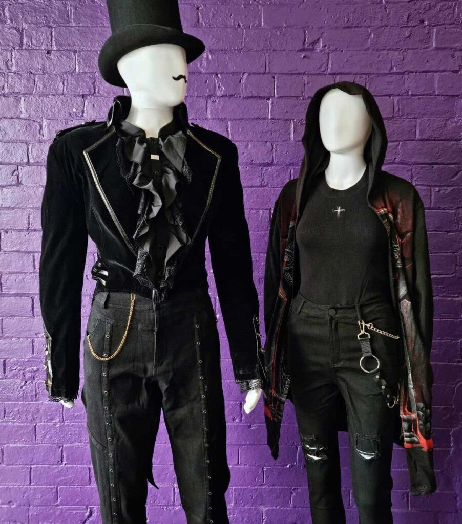 Two mannequins dressed in goth and steampunk clothing. One has a cheeky moustache