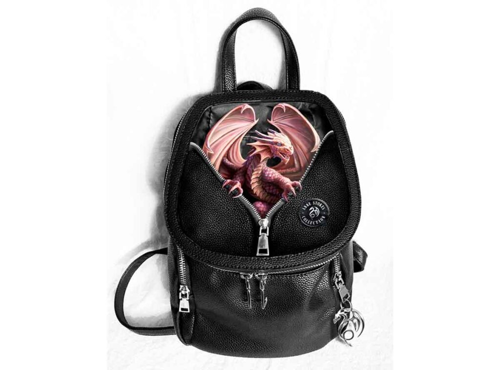 The front panel of this black backpack features a red dragon peeking through a zipper, holding the sides open with its claws. Super cute!