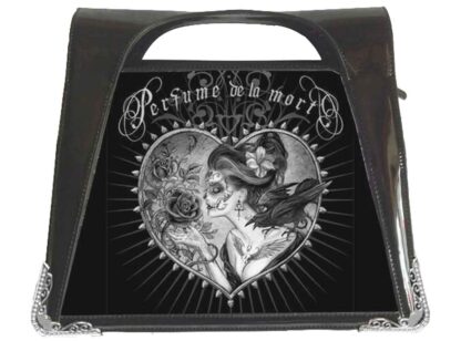 The front panel has a black and white image of a woman with day of the dead make up and a flower in her hair leaning in to smell a gothic rose. The words Perfume De La Mort are enscribed above her in fancy swirly writing.