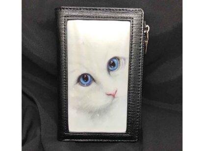 The front panel features a snowy white cat with piercing blue eyes gazing at the viewer
